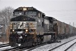 Grain train rolls east in the snow